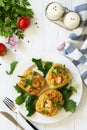 Peppers stuffed with quinoa, shrimp and vegetables on white wooden table. Top view flat lay background Royalty Free Stock Photo