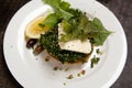 Vegetarian dish with tabbouleh, feta cheese, rocket, olives and lemon setting on top of a pumpkin pie Royalty Free Stock Photo