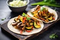 vegetarian fajitas with mushrooms and zucchini on a slate surface Royalty Free Stock Photo