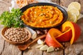 Vegetarian food: hummus with pumpkin and ingredients close-up. h Royalty Free Stock Photo