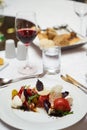 Vegetarian food with marinated tomatoes, arugula, mozzarella che Royalty Free Stock Photo