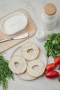 Vegetarian food with round toast, bottle, vegetables and cheese/Healthy food with round toast, bottle, vegetables and cheese on