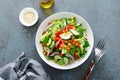 Vegetarian fresh vegetable organic salad with cucumber, red bell pepper, red onion, corn and green lettuce Royalty Free Stock Photo