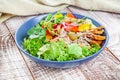 Vegetarian green pea salad with microgreen and vegetables on wooden white background. Royalty Free Stock Photo