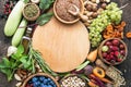 Vegetarian ingredients for cooking. Flat vegetables, fruits, beans, cereals, kitchen utensils, dried flowers, olive oil on a