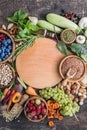 Vegetarian ingredients for cooking. Flat vegetables, fruits, beans, cereals, kitchen utensils, dried flowers, olive oil on a