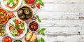 Vegetarian Italian Delights on a White Wooden Table at a Restaurant with Caprese Salad, Eggplant Royalty Free Stock Photo