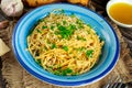 Vegetarian Italian Pasta Spaghetti Aglio E Olio with garlic bread, red chili flake, parsley, parmesan cheese and glas on Royalty Free Stock Photo