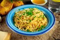 Vegetarian Italian Pasta Spaghetti Aglio E Olio with garlic bread, red chili flake, parsley, parmesan cheese and glas of water Royalty Free Stock Photo