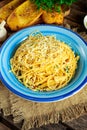 Vegetarian Italian Pasta Spaghetti Aglio E Olio with garlic bread, red chili flake, parsley, parmesan cheese and glas of water Royalty Free Stock Photo