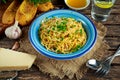 Vegetarian Italian Pasta Spaghetti Aglio E Olio with garlic bread, red chili flake, parsley, parmesan cheese and glas of Royalty Free Stock Photo