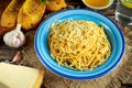 Vegetarian Italian Pasta Spaghetti Aglio E Olio with garlic bread, red chili flake, parsley, parmesan cheese and glas of Royalty Free Stock Photo