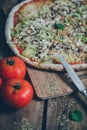 Vegetarian italian pizza on wodden table.