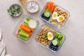 Vegetarian lunch meal prep containers high protein with quinoa, herbed chickpeas, vegetables and eggs