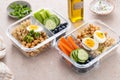 Vegetarian lunch meal prep containers high protein with quinoa, herbed chickpeas, vegetables and eggs