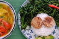 Vegetarian meal, rice dish with boiled water morning glory, vegan sausage, sour soup bowl Royalty Free Stock Photo