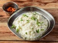 Vegetarian meal, Tasty Curd rice or Dahi Bhat or Dahi Chawal with pickle.Rice mixed with yogurt and seasoning, selective focus