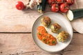 Vegetarian meatball alternative, fried vegetable balls from zucchini, potato and ginger with tomato sauce and ingredients on a Royalty Free Stock Photo