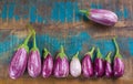 Vegetarian menu template - small fresh eggplants on wooden table
