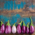 Vegetarian menu template - small fresh eggplants on wooden table