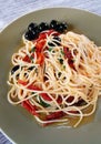 Vegetarian pasta with black olives & tomatos