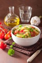 Vegetarian pasta fusilli with tomato peas herbs Royalty Free Stock Photo