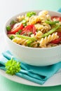 Vegetarian pasta fusilli with tomato peas herbs Royalty Free Stock Photo