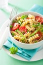 Vegetarian pasta fusilli with tomato peas herbs Royalty Free Stock Photo