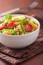 Vegetarian pasta fusilli with tomato peas herbs Royalty Free Stock Photo