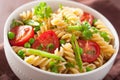 Vegetarian pasta fusilli with tomato peas herbs Royalty Free Stock Photo