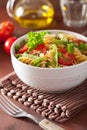 Vegetarian pasta fusilli with tomato peas herbs Royalty Free Stock Photo