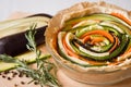 Vegetarian pie with eggplants, carrots, squash, zucchini, pepper and rosemary. Royalty Free Stock Photo