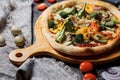 Vegetarian pizza with greens and broccoli, zucchini and pepper. Slimming pizza.