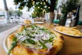 Vegetarian pizza in street fast food outdoor cafe. Royalty Free Stock Photo