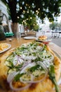 Vegetarian pizza in street fast food outdoor cafe. Royalty Free Stock Photo