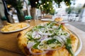 Vegetarian pizza in street fast food outdoor cafe. Royalty Free Stock Photo