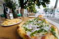 Vegetarian pizza in street fast food outdoor cafe. Royalty Free Stock Photo