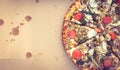 Vegetarian pizza in a takeaway box. Lies flat and the view from above. Copy space and warm filter color. Royalty Free Stock Photo