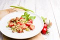 Vegetarian Quinoa salad dish on white wooden background