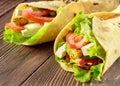 Vegetarian roll with vegetables and tofu on wooden table Royalty Free Stock Photo