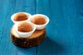 Vegetarian round lentil sweets in cocoa powder on oak board copy