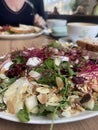 Vegetarian salad with almonds, beetroot sprouts, pears and cheese, restaurant& x27;s signature dish.