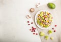 Vegetarian salad from romanesco cabbage, champignons, cranberry, avocado and pumpkin on a white wooden background. top view, copy Royalty Free Stock Photo