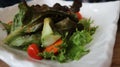 Vegetarian salad served on white plate