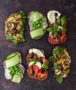 Vegetarian sandwich toasts with different toppings, top view. Flat lay of rye bread crostini Royalty Free Stock Photo