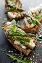 Vegetarian sandwich. Wholemeal bread sandwiches with feta cheese, grilled zucchini, green asparagus, sugar peas, olive oil and her Royalty Free Stock Photo
