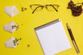 Vegetarian seeds in handmade bags, notebook, pen, glasses on a yellow background. View from above. Place for an inscription. Royalty Free Stock Photo