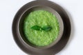 Vegetarian soup of broccoli puree on a white background. The concept of healthy eating