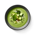 Zucchini puree soup, top view on a white background