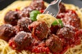 Vegetarian spaghetti with meat free, vegan meatballs in rich tomato sauce, grated cheese and basil leaves